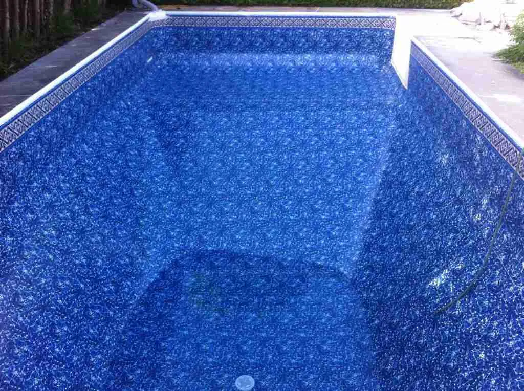 Triad Pool Management LLC removing old pool liner