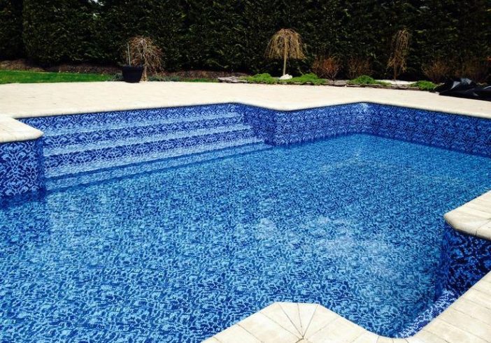 Triad Pool Management LLC technician measuring pool interior